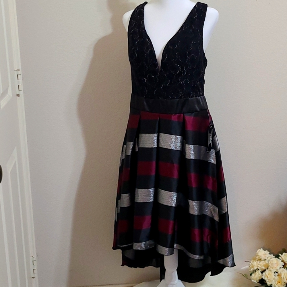 Beautiful special occasion dress, size 14, never worn, new with tags! Prom style